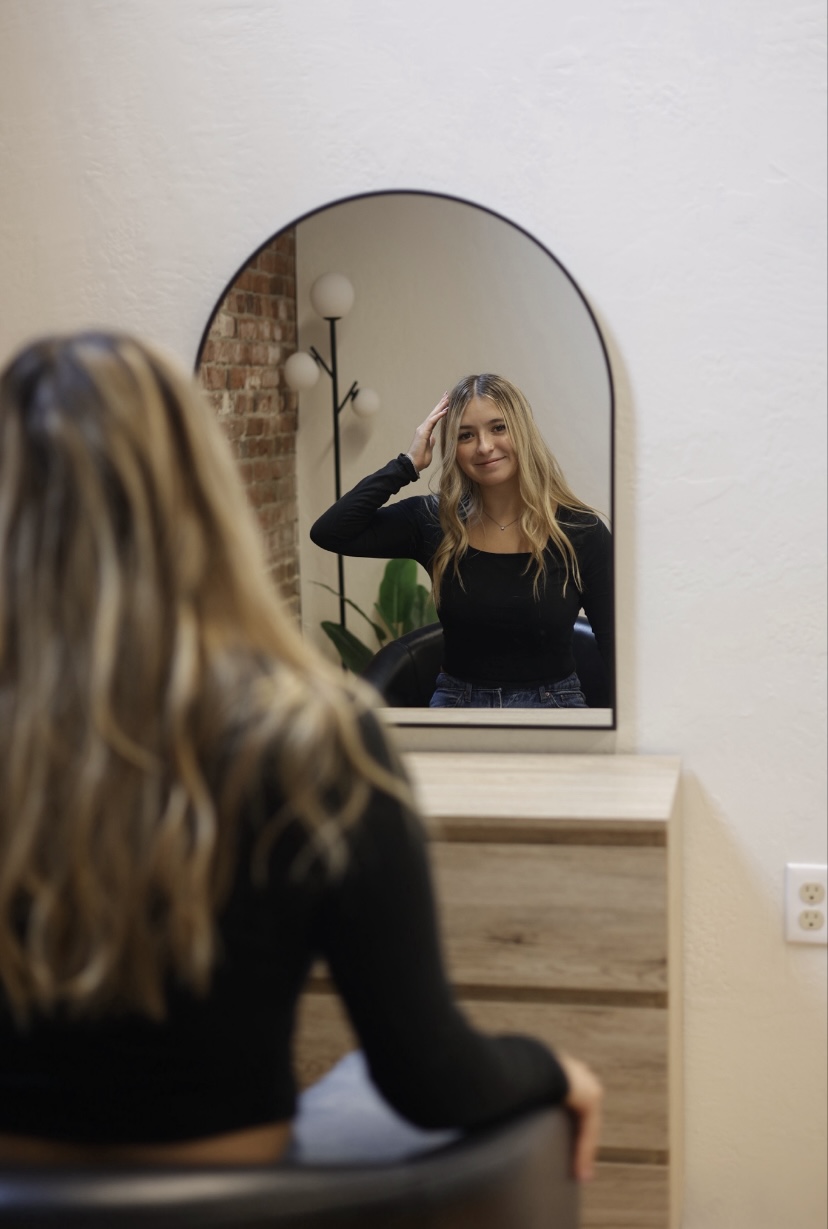 Emma, hairstylist at Emma Yook Hair, in the salon
